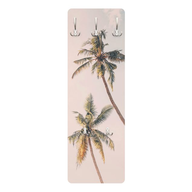 cabideiro de parede Two palm trees against a pink sky